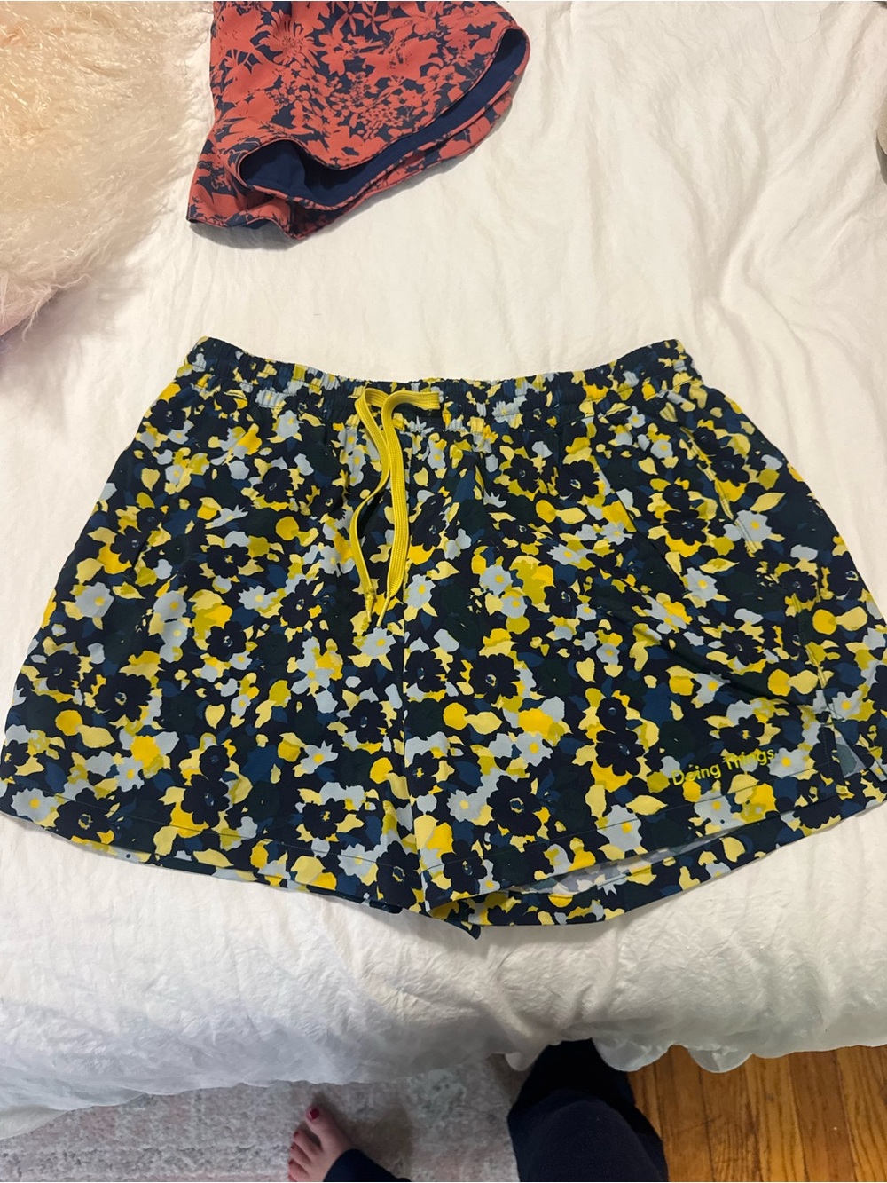 Outdoor Voices Navy Floral Athletic Shorts with Yellow Drawstring